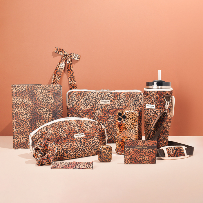 Leopard print AirPods case and matching accessories displayed on a neutral background.