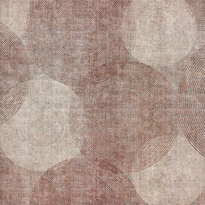 Brown and cream rug featuring an overlapping pattern of concentric circular line motifs.