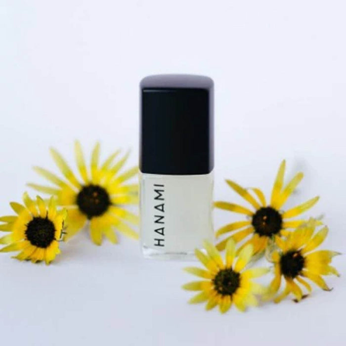 Hanami nail polish bottle with sunflowers on a white background.
