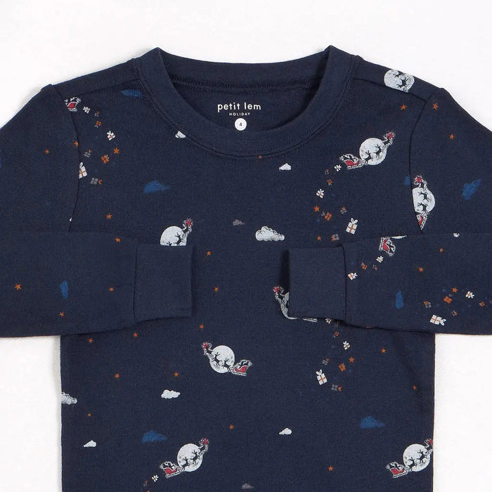 Closeup of Petit Lem boys glow-in-the-dark pajama top with nighttime print on organic cotton rib.