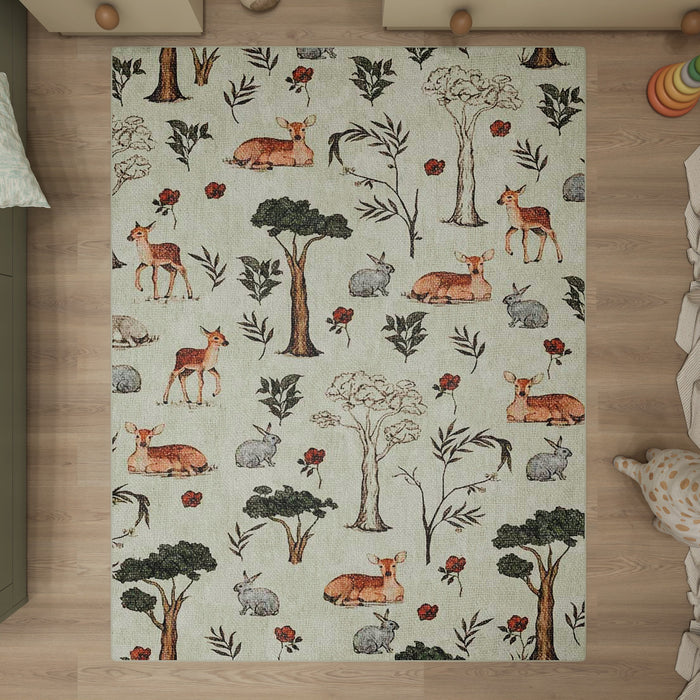 Light green rug with a woodland pattern of deer, rabbits, trees, and red flowers, styled in a nursery setting.