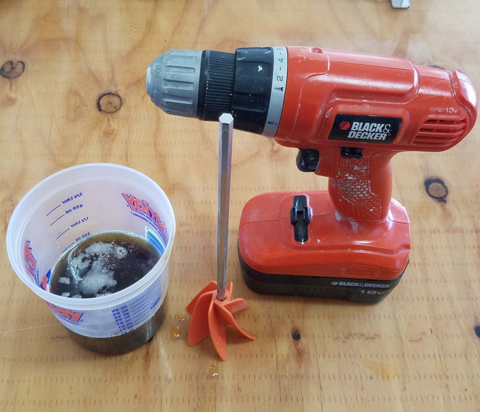 2lb Polyurethane Pour Foam in Mixing/Measuring Cup Ready to be Mixed