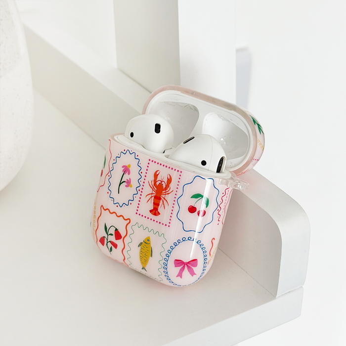 Dolce Vita AirPods case with colorful fruit and lobster pattern, glossy finish, by Coconut Lane.