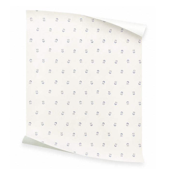 Betty Cornflower wallpaper with petite blue floral motifs on an ivory ground, made to order in the USA with short lead times