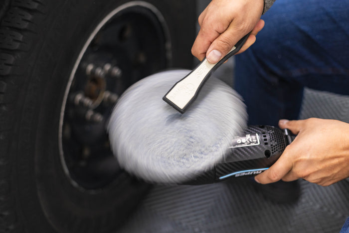 Rupes Claw tool being used on a polisher pad.