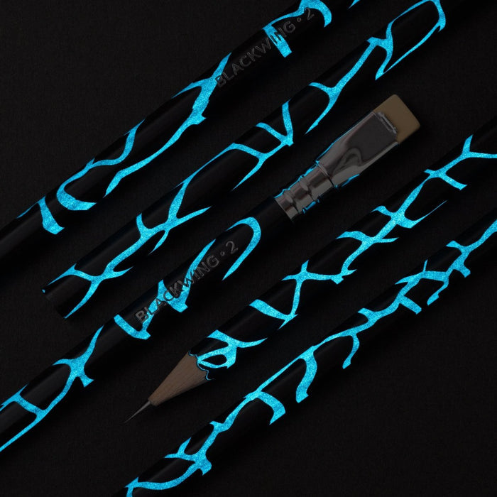 Blackwing Volume 2 pencil, black barrel with cracked blue design that glows in the dark
