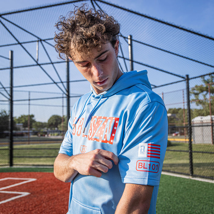 Adult model wearing blue BSBL-SZN Freedom short sleeve hoodie