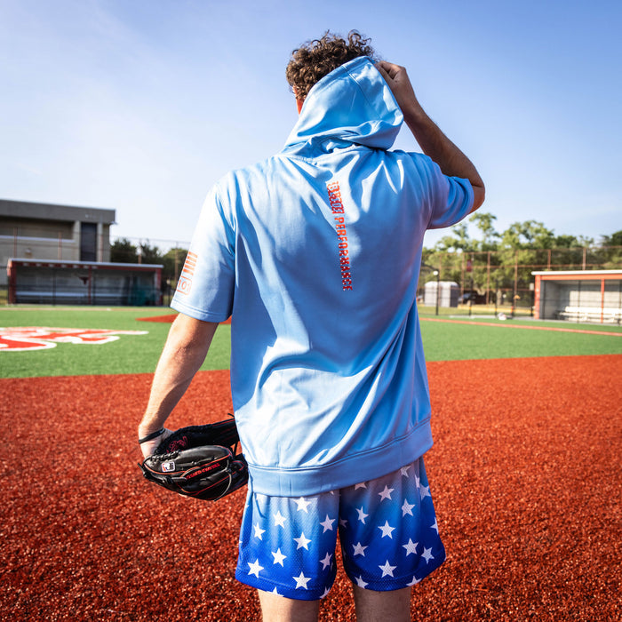 Adult model wearing blue BSBL-SZN Freedom short sleeve hoodie