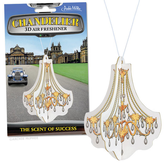 The Chandelier Deluxe 3D Air Freshener, set against a historic building backdrop and aptly captioned "Smells Like Success," exudes a luxurious essence. It is ideal for those looking to add a touch of opulence to their surroundings.