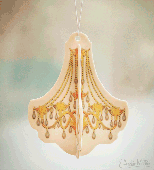 The Chandelier Deluxe 3D Air Freshener adorns the room with its ornate yellow and brown design, evoking the opulent atmosphere of a grand ballroom. Its sophisticated presence against a softly blurred backdrop embodies an essence that exudes success.