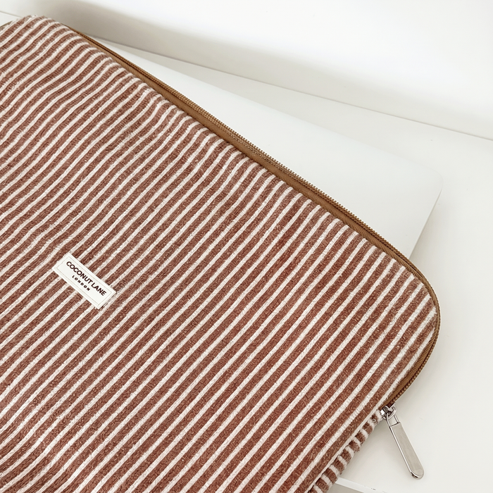 Brown and white stripe Laptop Sleeve with zip closure and Coconut Lane logo.