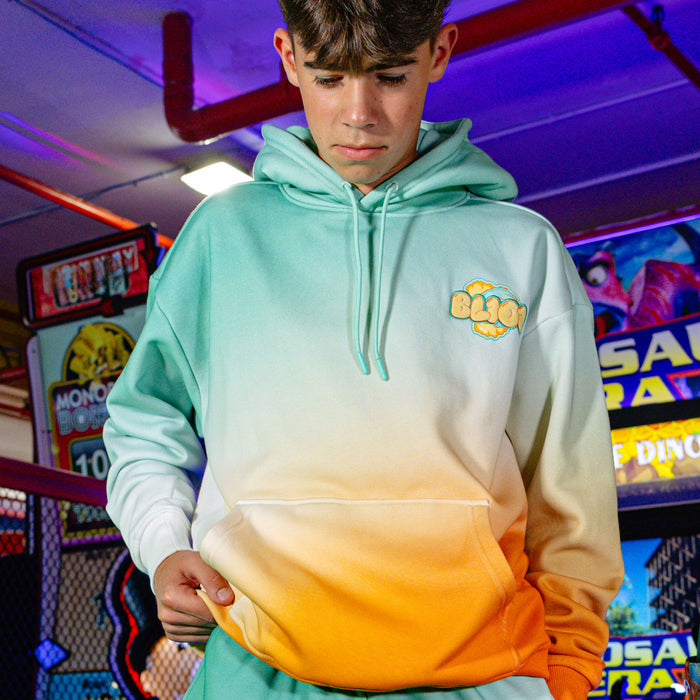 Adult model wearing Cotton Candy Tangerine Freeze hoodie