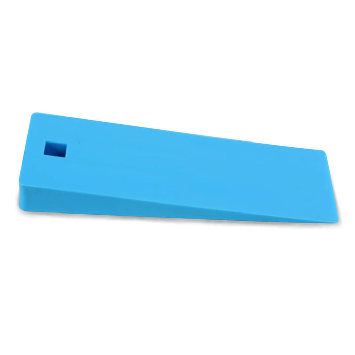Small blue demolding wedge. Thicker on one end and thinner on the other. Hanging hole on one end.