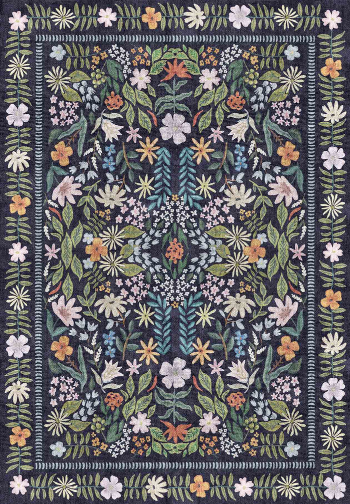 Navy blue rug with a symmetrical botanical pattern of multicolored flowers and leaves and a floral border.