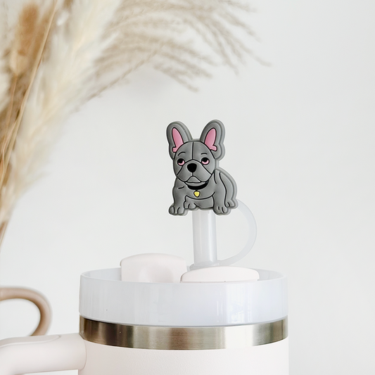 Blue Frenchie straw cover by Coconut Lane on a white tumbler, with pampas grass in the background.