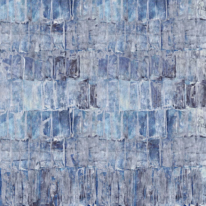 Blue and grey rug with an abstract, distressed block-print pattern.