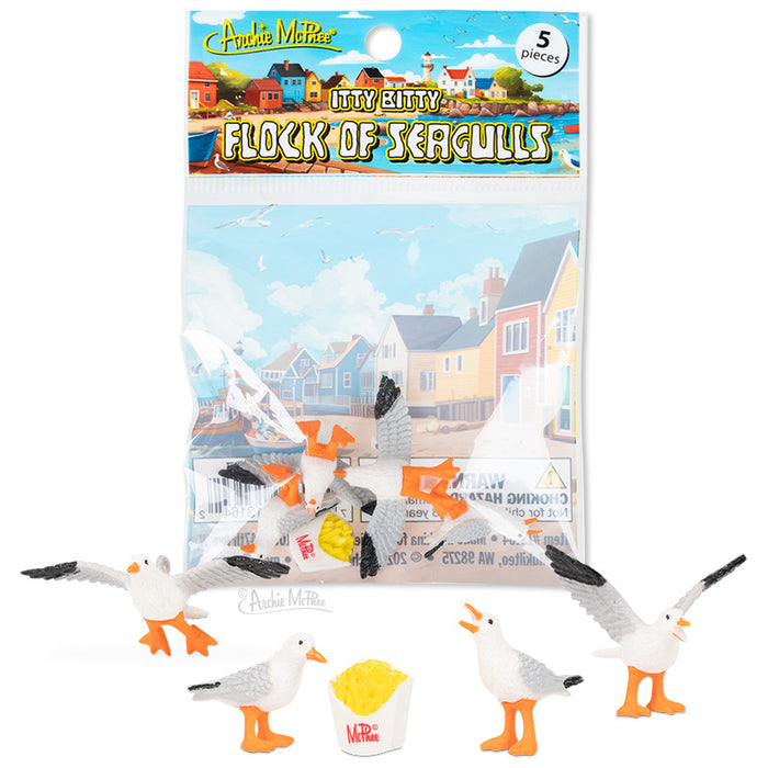 The Itty Bitty Flock of Seagulls includes five small soft vinyl seagulls with a fries container, packaged in front of seaside houses.