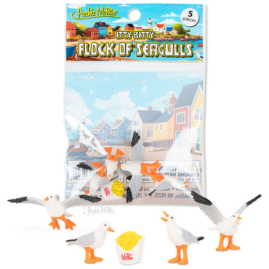 The Itty Bitty Flock of Seagulls includes five small soft vinyl seagulls with a fries container, packaged in front of seaside houses.