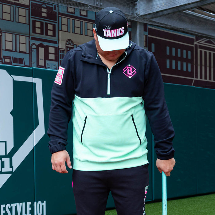 Adult model wearing teal quarter zip hoodie with "King Of JUCO" design