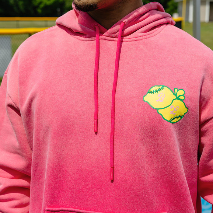 Adult model wearing pink hoodie with "Lemon Dingers" design