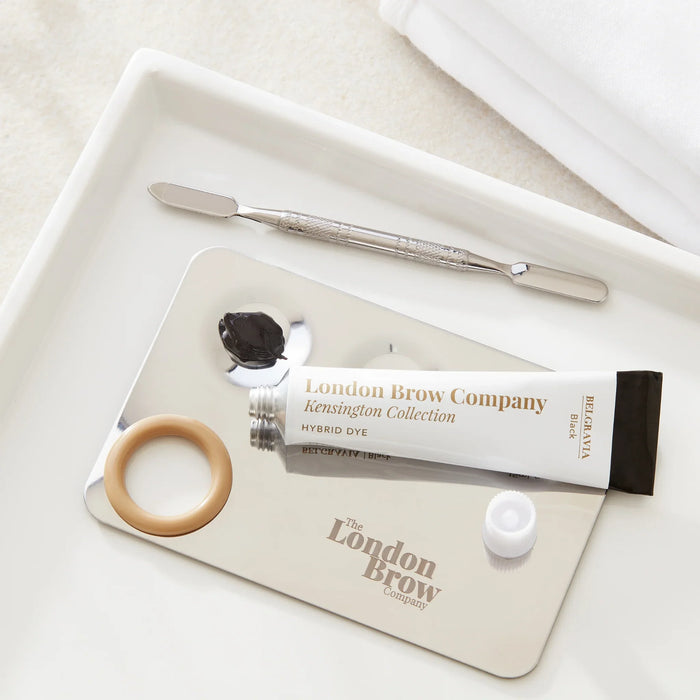 London Brow Company hybrid dye tube with applicator on a white tray