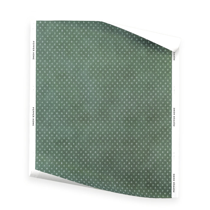 Maude Celadon wallpaper in a sage green pattern with tiny ivory motifs, made to order in the USA with short lead times