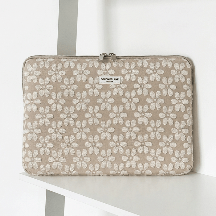 Brown and beige floral design Laptop Sleeve with zip closure and Coconut Lane logo.