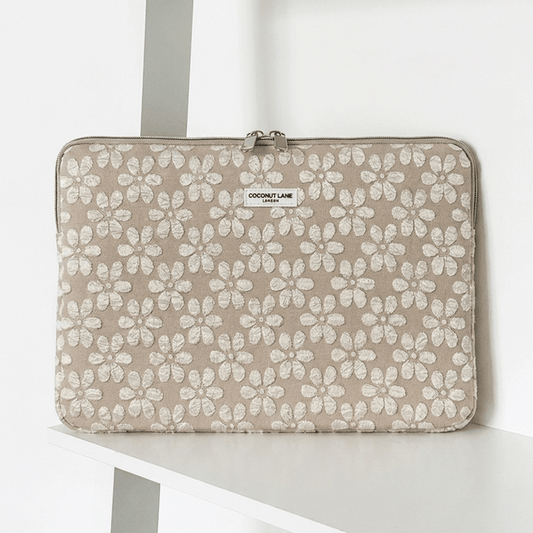 Brown and beige floral design Laptop Sleeve with zip closure and Coconut Lane logo.