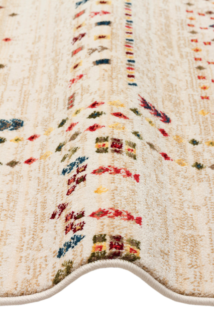 Cream rug with vertical stripes and small, multicolored geometric motifs in red, blue, yellow, and green.