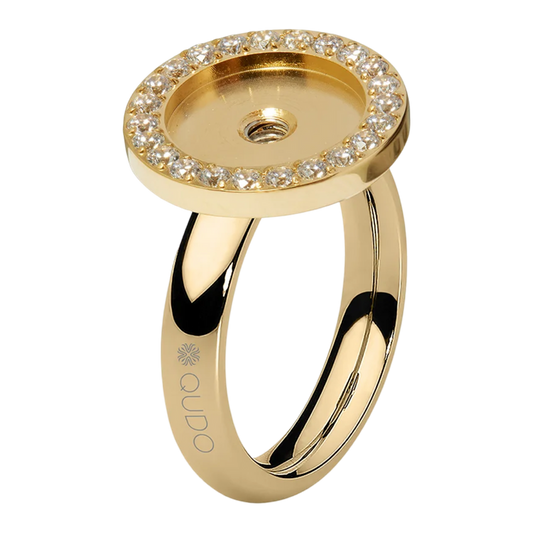 Gold ring with diamond-studded top on a white background