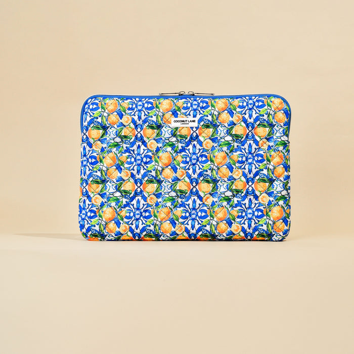 Quilted Coconut Lane laptop sleeve with a beige background and colorful geometric lemon and fruit pattern.