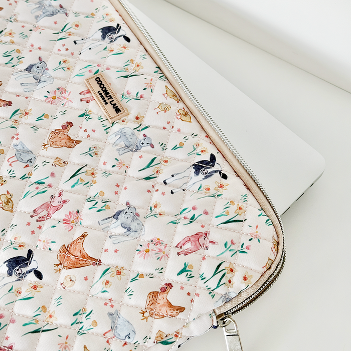 Quilted laptop sleeve with colorful rabbit pattern by Coconut Lane.