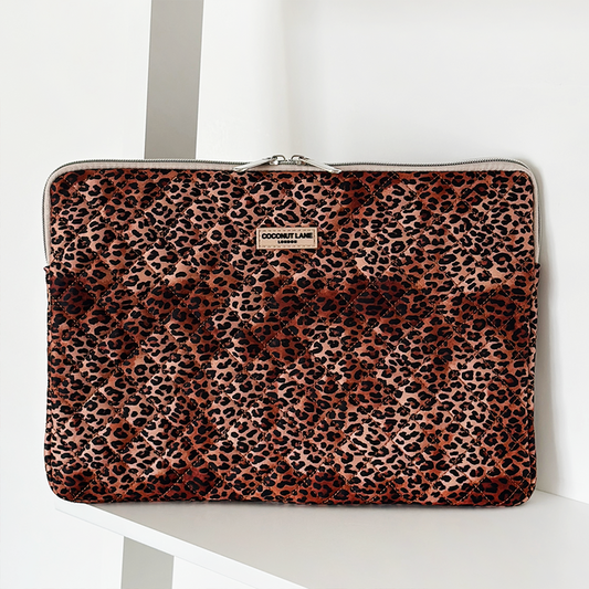 Coconut Lane quilted laptop sleeve with leopard print and zipper closure.