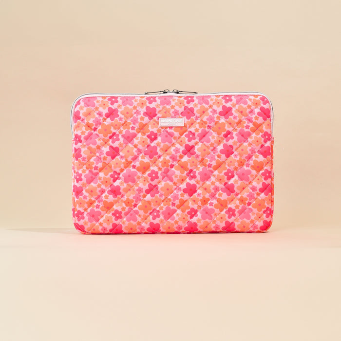 Quilted laptop sleeve in pink and orange with a floral bloom pattern by Coconut Lane.