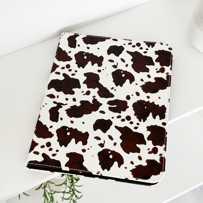 Pink iPad case with playful western-themed cowgirl illustrations and bold accents by Coconut Lane.