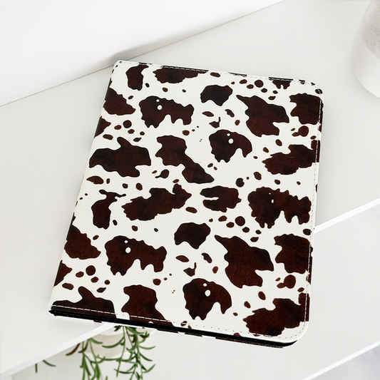 Pink iPad case with playful western-themed cowgirl illustrations and bold accents by Coconut Lane.