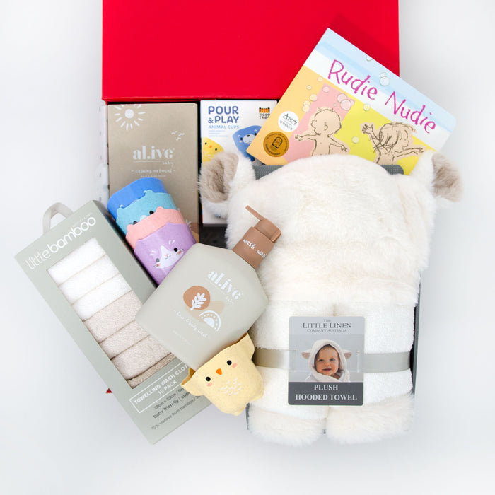 A baby gift hamper set including a plush hooded towel with lamby ears, organic hair and body wash, bamboo towelling washers, animal cups for bath time, and a board book. Price: 149