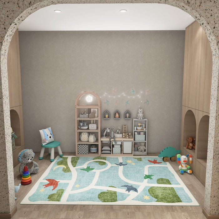 Light blue rug with a white road map pattern and green landscape accents, styled in a children's playroom.