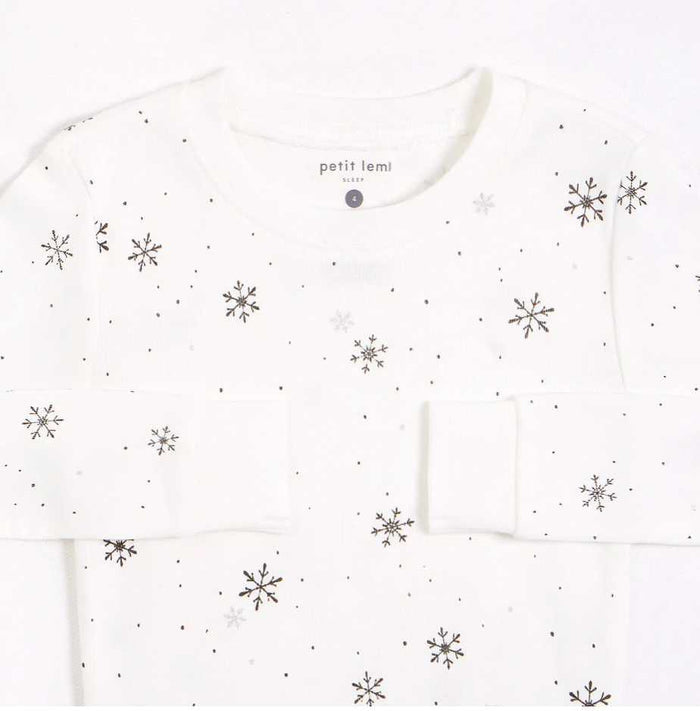 Closeup of Petit Lem girls Snowflake pajama top with rounded neckline and organic cotton rib fabric.
