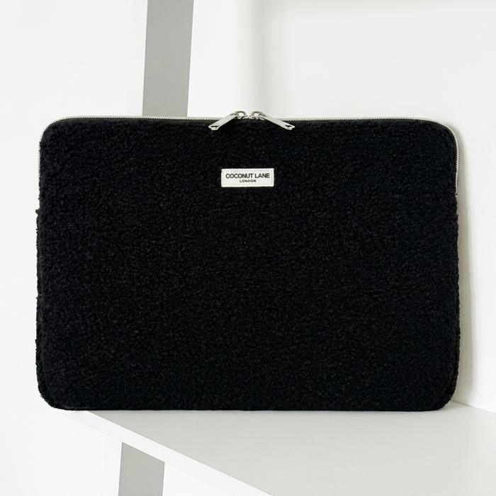 Teddy black boucle textured Laptop Sleeve with zip closure and Coconut Lane logo.