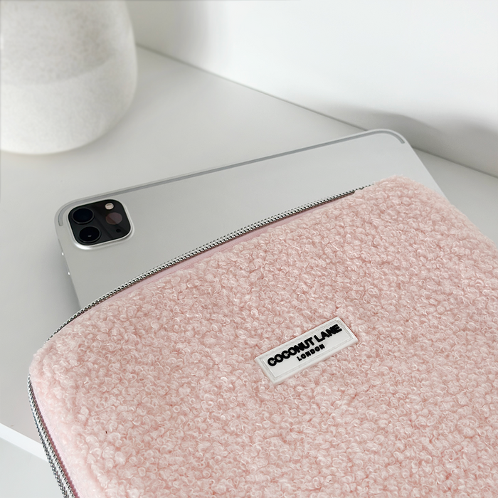 Silver iPad partially inside a pink textured Coconut Lane Teddy Love-A-Lot iPad sleeve.