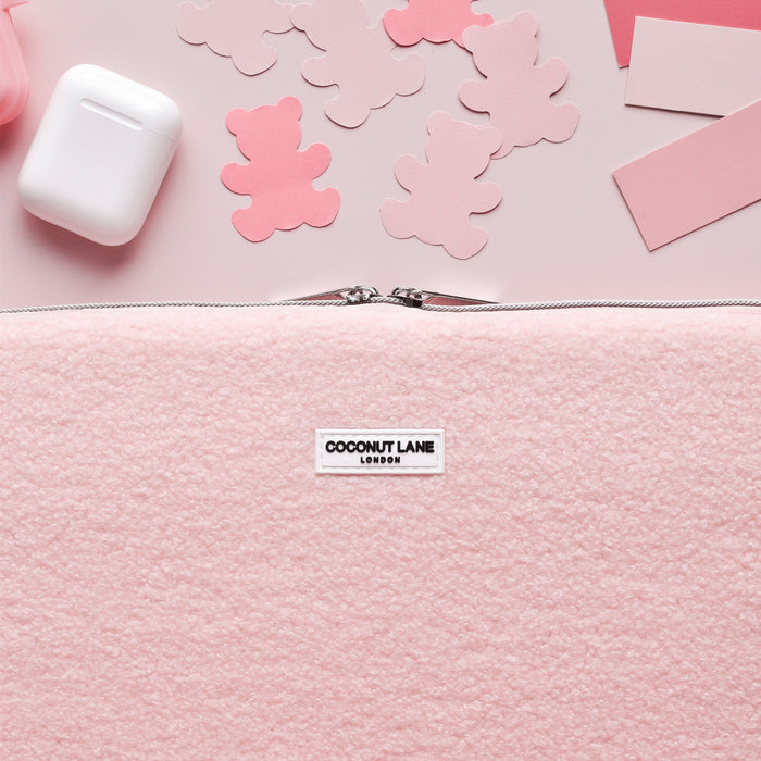Pink Teddy Love-a-Lot laptop sleeve with bear print, matching AirPods case, and pouch on a pink background.