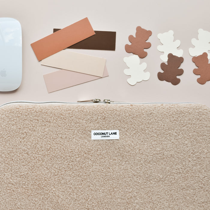 Coconut Lane Teddy Rupert laptop sleeve with bear cutouts, a computer mouse, and brown color swatches on a light background.