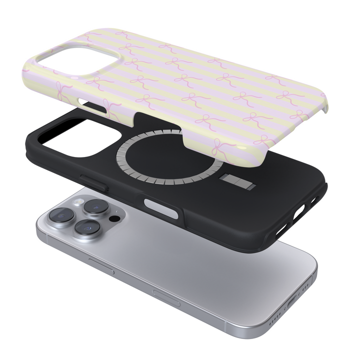 Expanded Magsafe phone case with a pink and yellow stripes with bows on white background