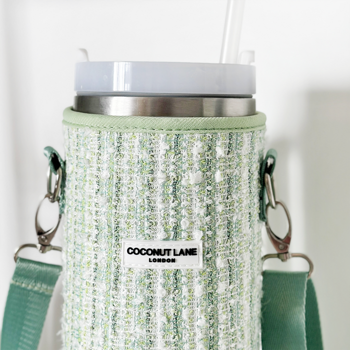 Coconut Lane tumbler carry case in matcha green textured tweed with a strap, displayed on a white background.