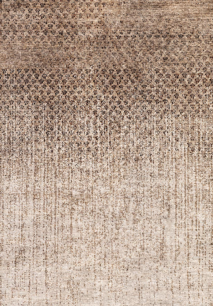 Brown and beige rug with a distressed, speckled ombre pattern fading from dark to light.