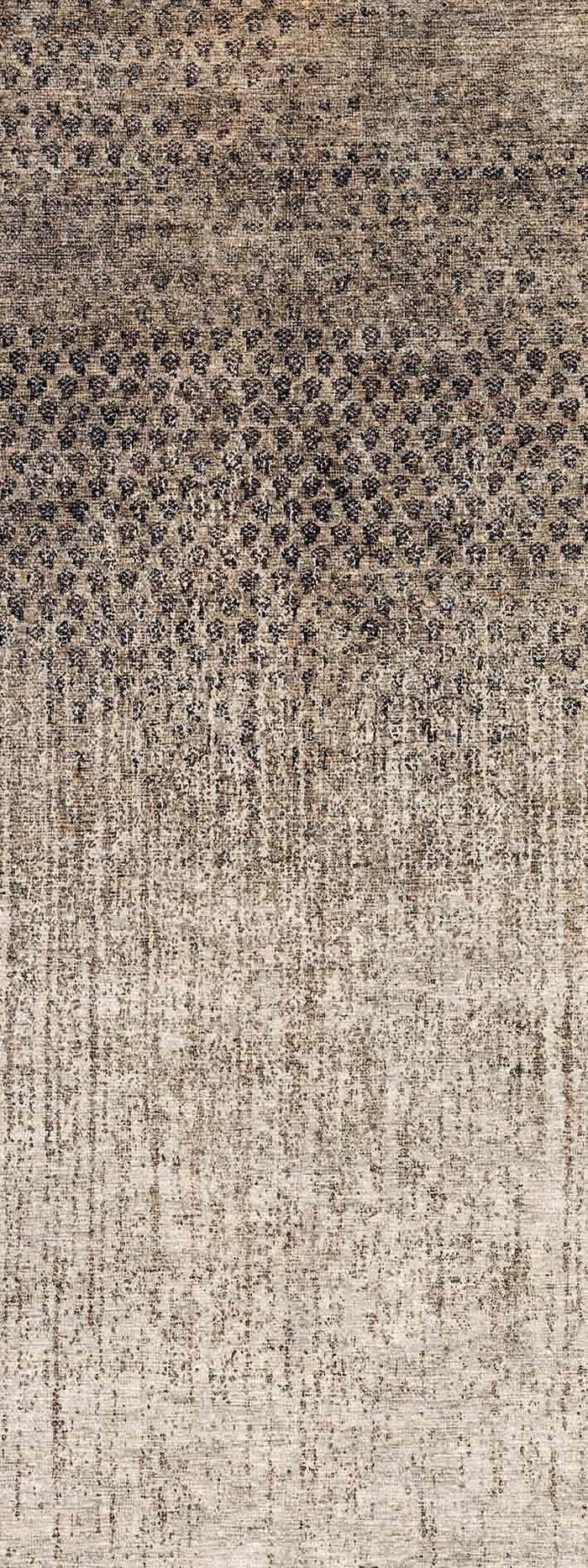 Charcoal and beige rug with a distressed, gradient ombre pattern transitioning from dark geometric motifs to a light fade.