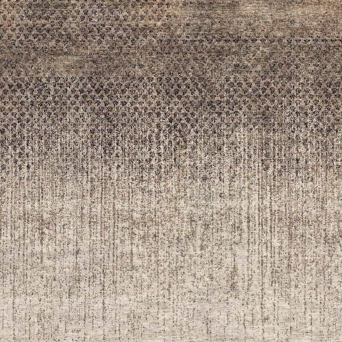 Brown and beige rug with a dark, dense geometric pattern at the top fading into a vertical, distressed texture.