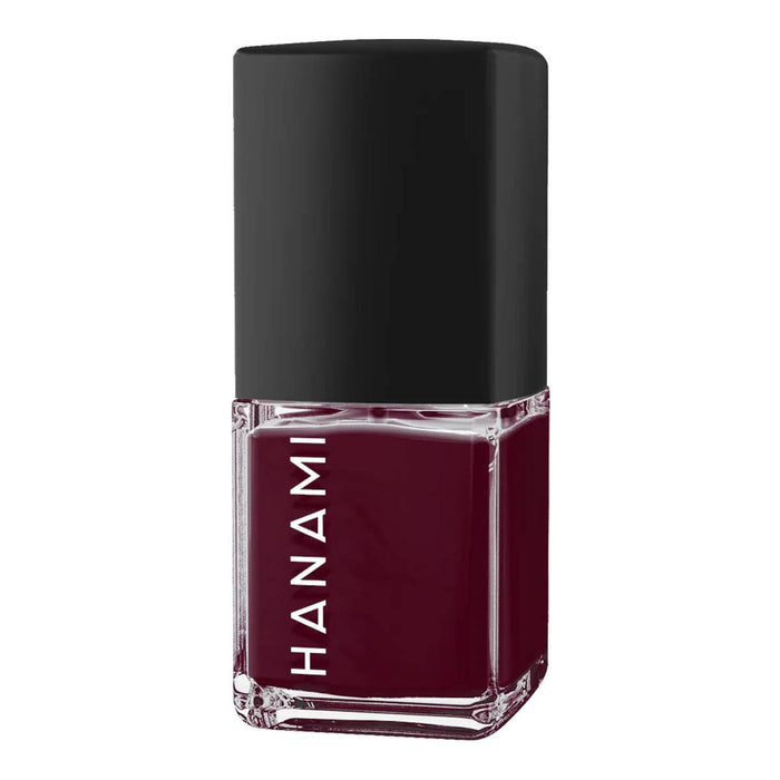 Nail polish bottle with black cap and burgundy colour on a white background.