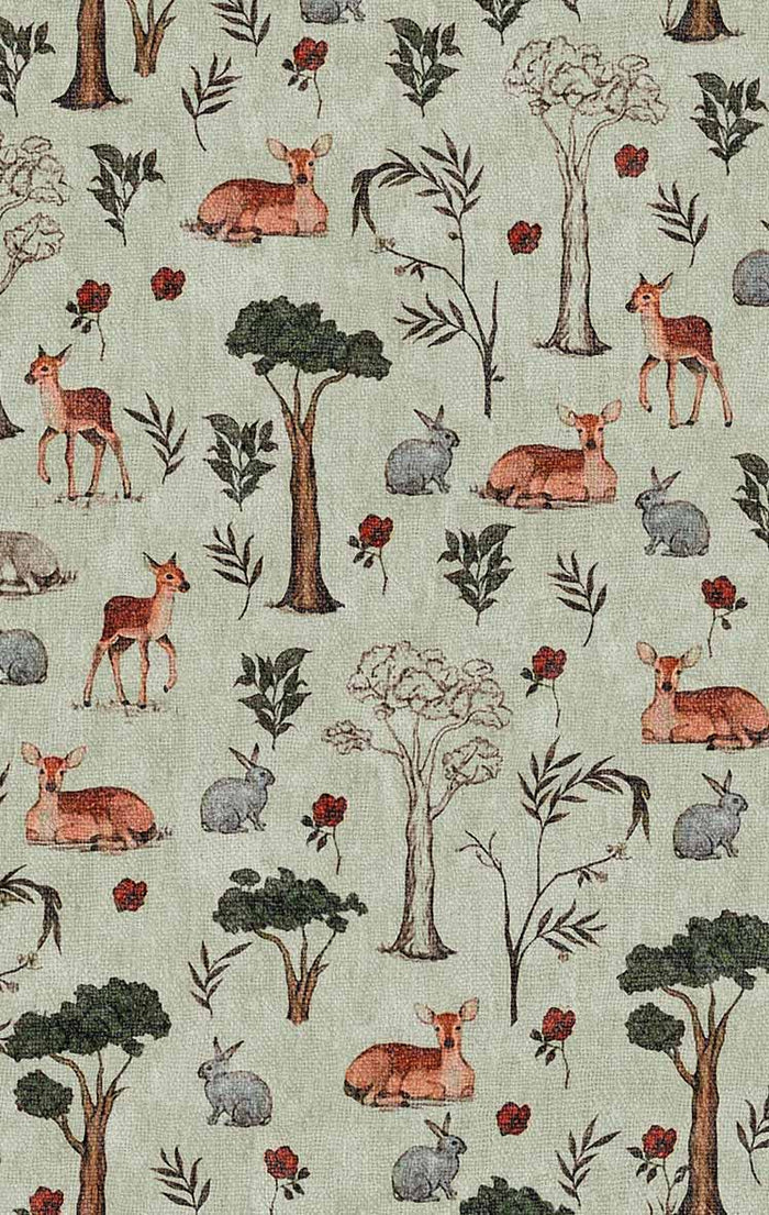Sage green rug featuring a repeating woodland pattern of deer, rabbits, trees, and small red flowers.